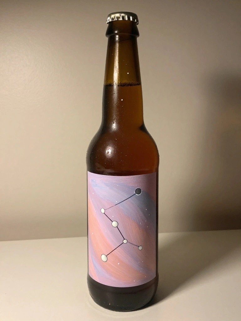 Brown glass bottle with colorful constellation label on white surface