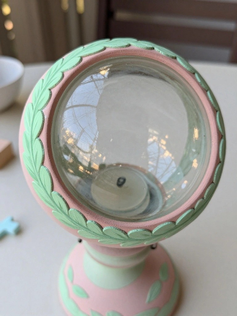 Pink and mint green candle holder with glass globe and leaf motifs