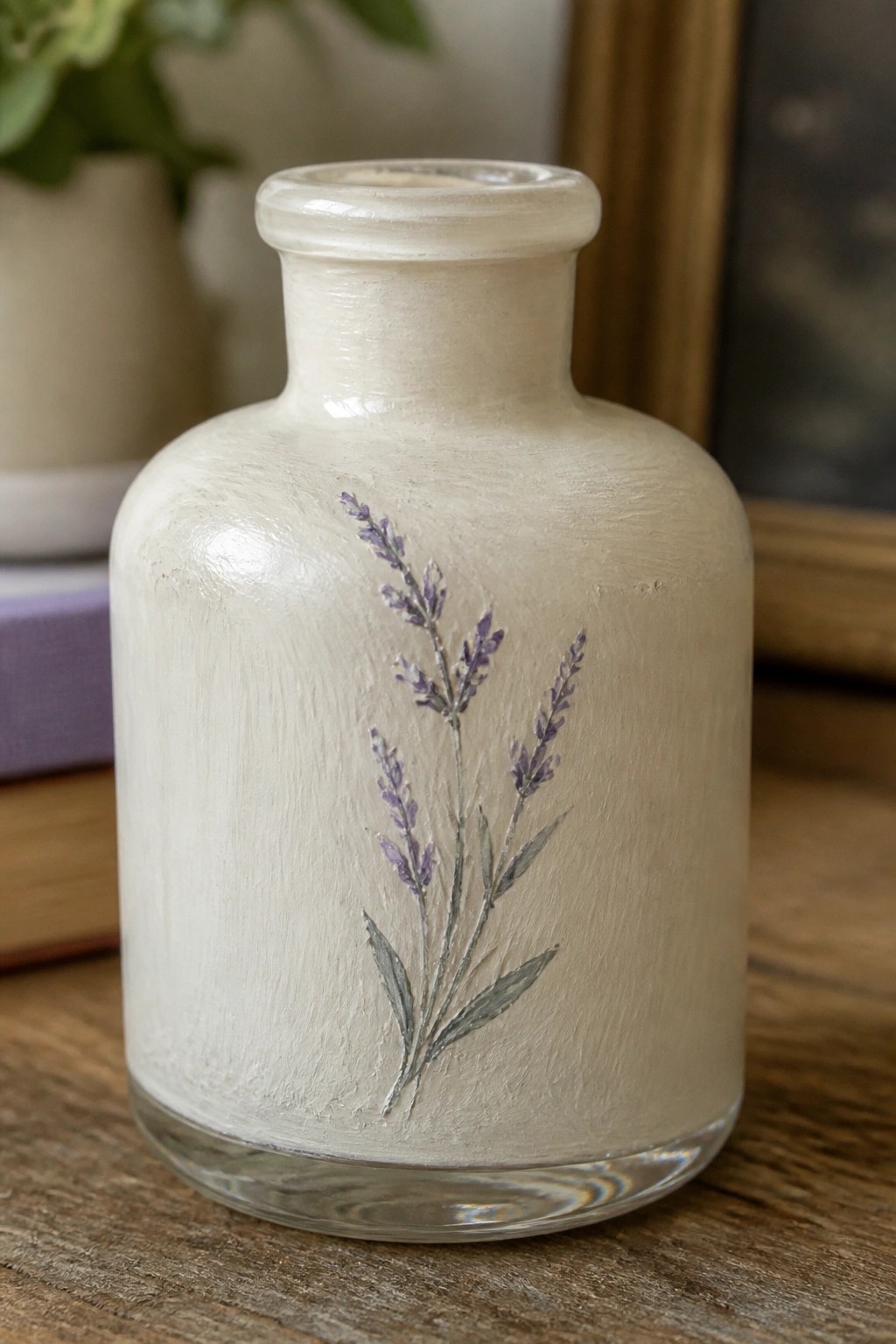 White textured glass bottle with lavender sprig on wooden table