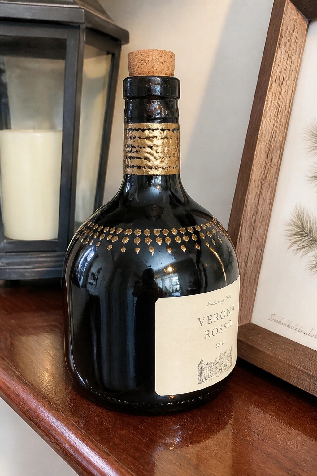 Black Verona Rosso 2018 bottle with gold neck band and dots on wooden shelf